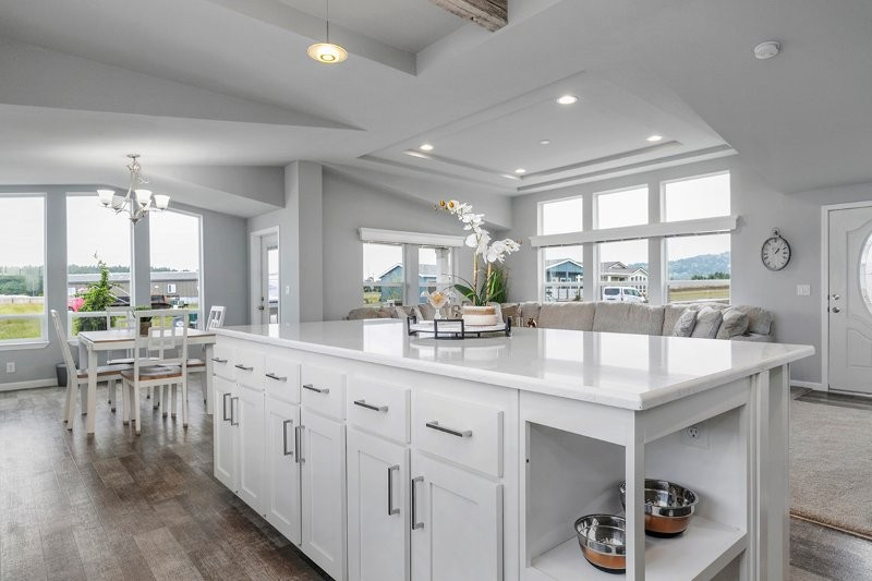airy open plan home with oversized kitchen island at lavender meadows in sequim wa