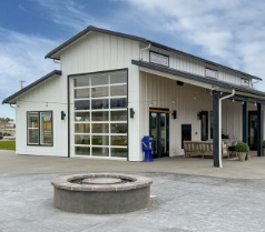 crisp clubhouse exterior and stone fire pit at lavender meadows in sequim wa