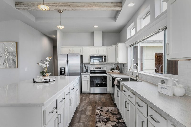 elegant kitchen with white cabinetry and island at lavender meadows in sequim wa