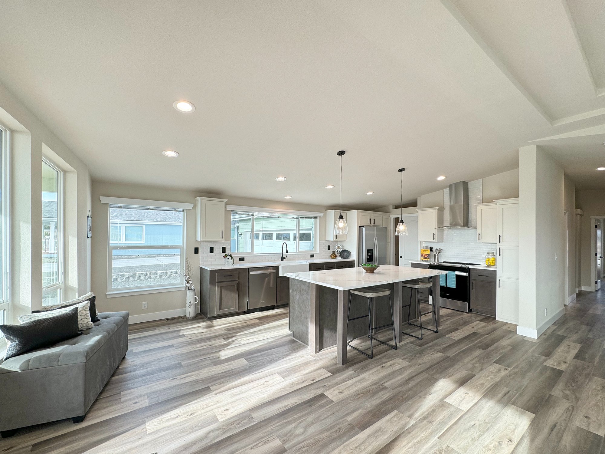 expansive kitchen with wood look flooring at lavender meadows in sequim wa