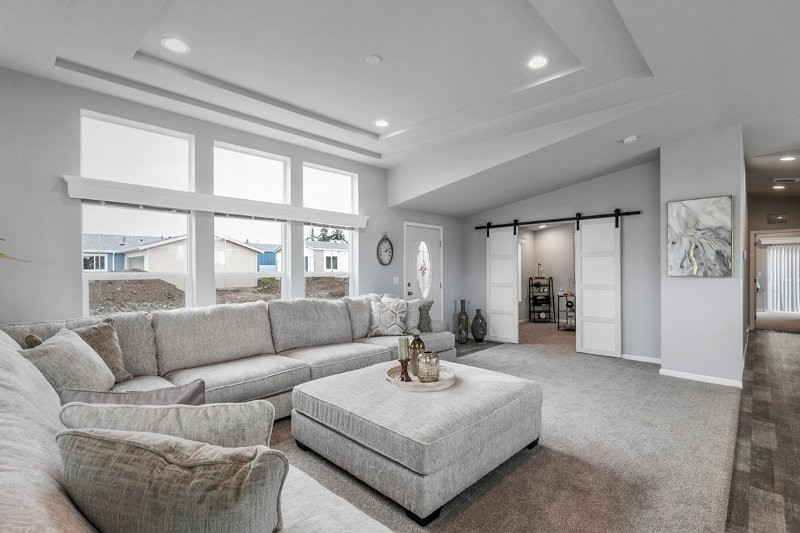 expansive living room with sliding barn doors at lavender meadows in sequim wa