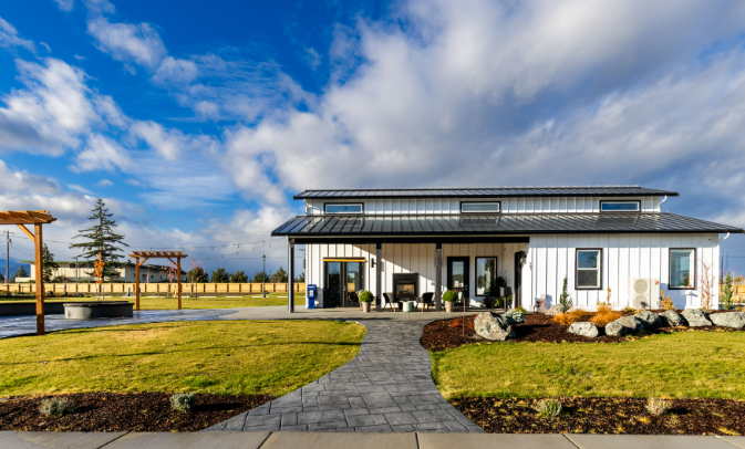 inviting modern clubhouse with stamped concrete walkway at lavender meadows in sequim wa