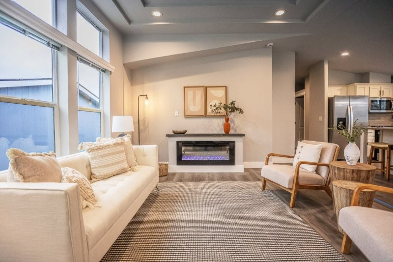 serene living room with linear electric fireplace at lavender meadows in sequim wa