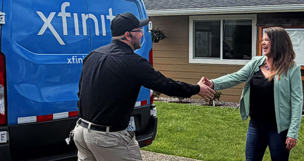 Xfinity team member arriving to a manufactured home